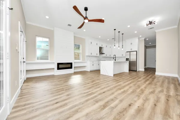 a view of kitchen with cabinets and wooden floor