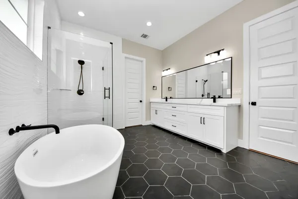 a view of bathroom with a bathtub and shower