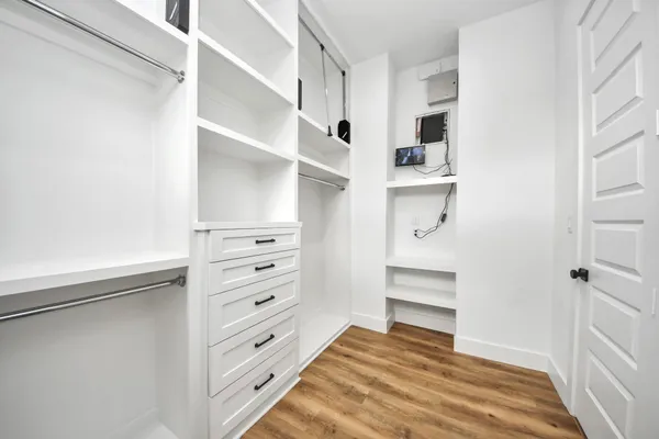 a view of cabinets and wooden floor
