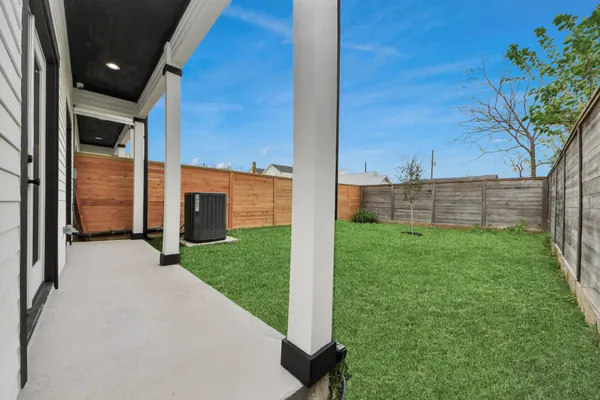 a backyard of a house with lots of green space