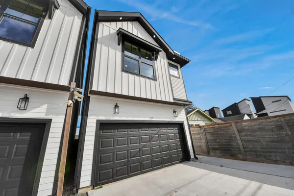 a front view of a house with garage