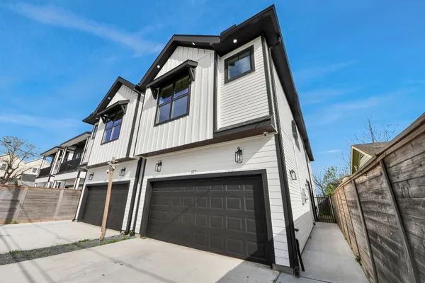 a front view of a house with garage