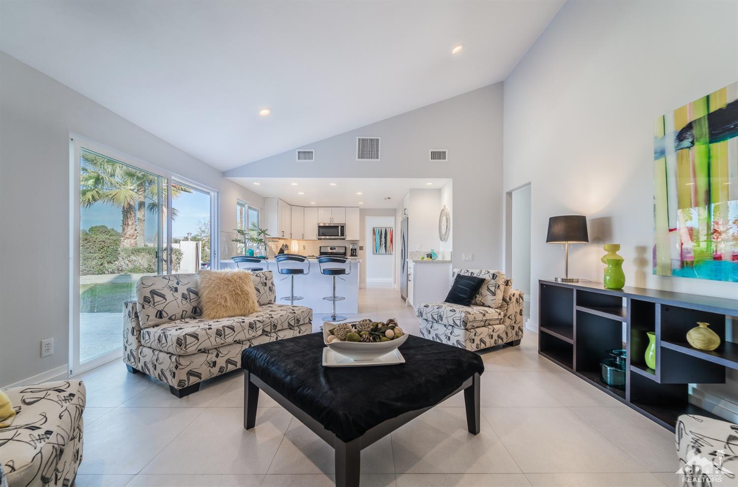 72845 Haystack Road Palm Desert, CA 92260 - Photo 12 of 39 a living room with furniture and a large window