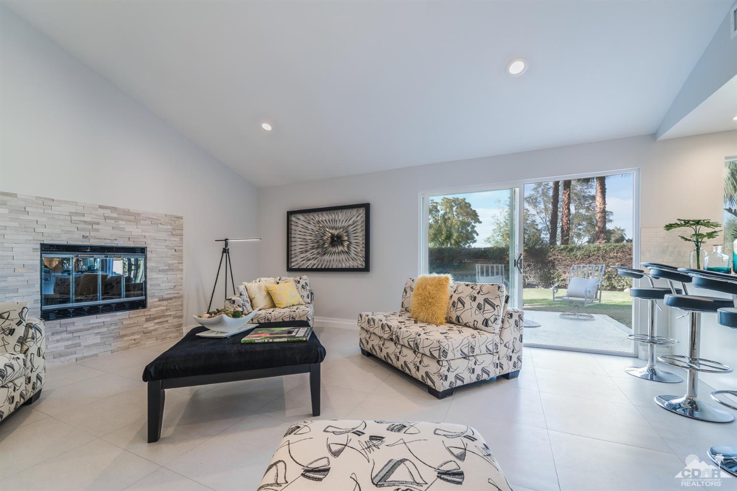 72845 Haystack Road Palm Desert, CA 92260 - Photo 14 of 39 a living room with furniture and a large window