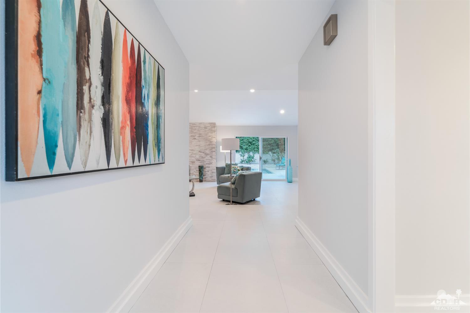 72845 Haystack Road Palm Desert, CA 92260 - Photo 3 of 39 a view of a hallway with furniture and a window