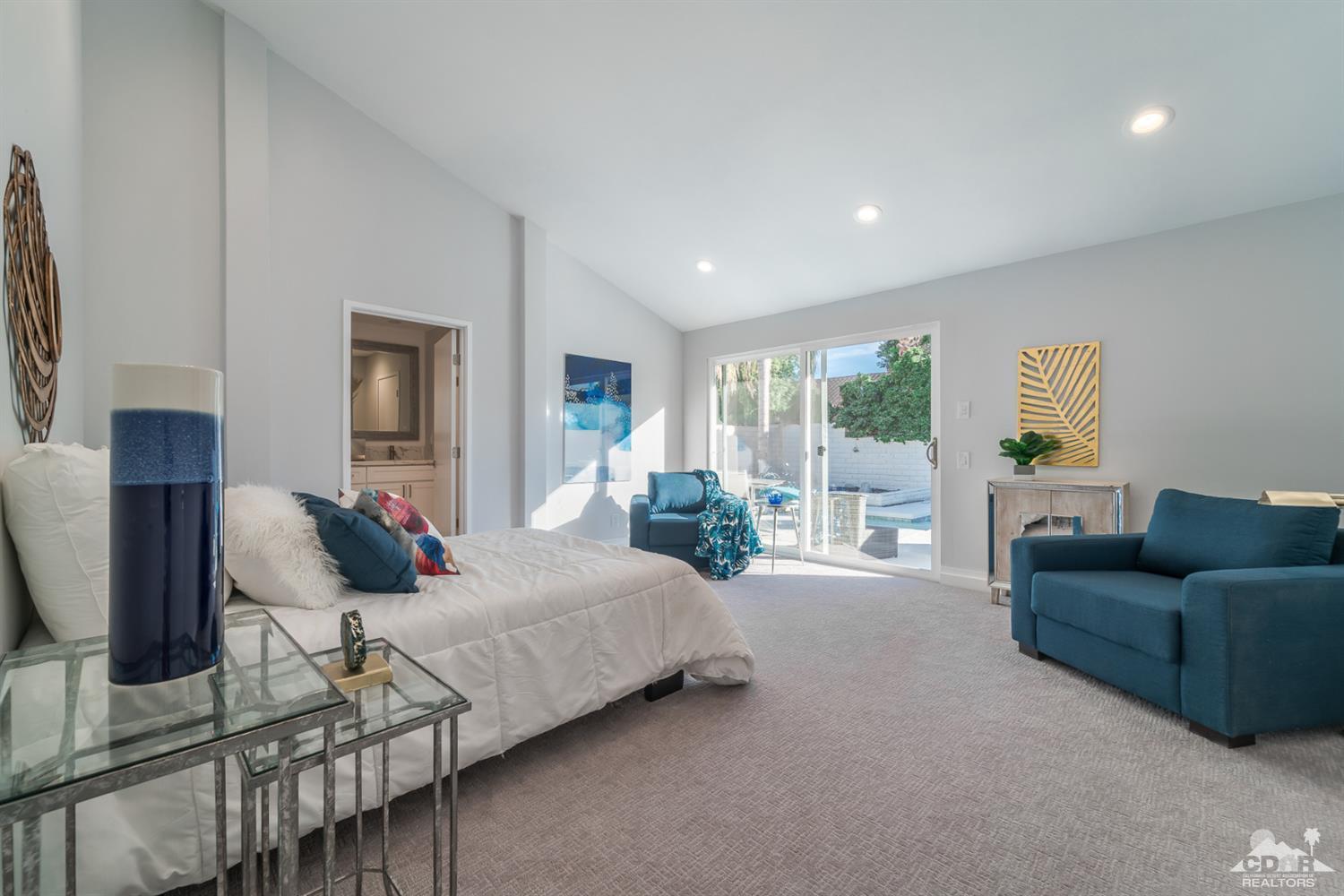 72845 Haystack Road Palm Desert, CA 92260 - Photo 21 of 39 a bedroom with furniture and large windows