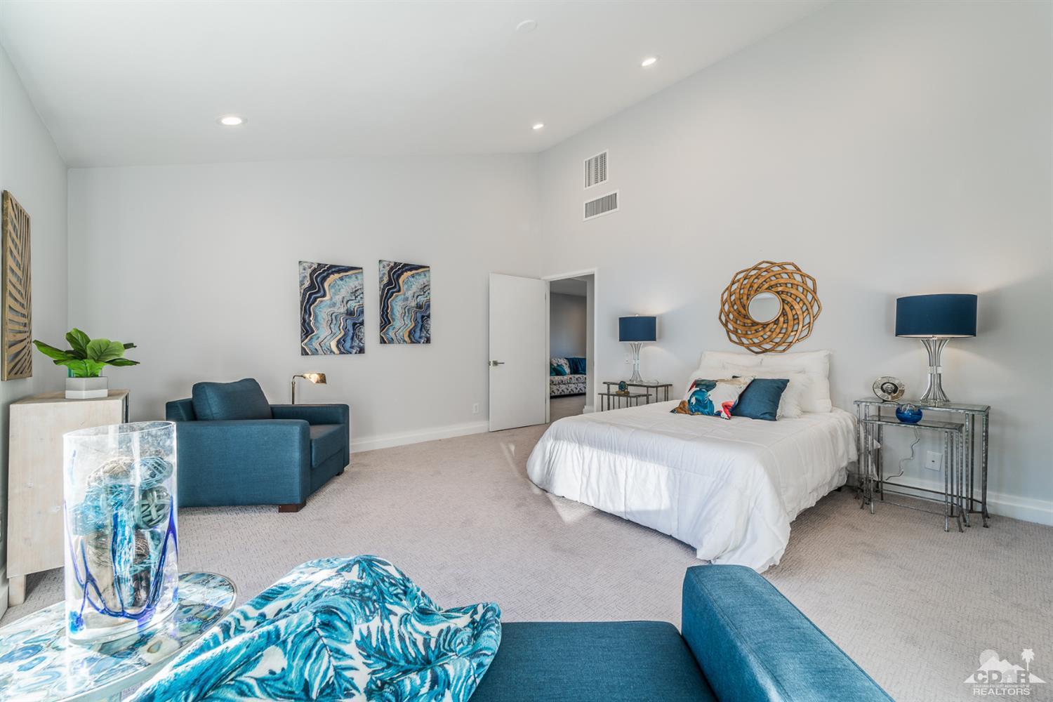 72845 Haystack Road Palm Desert, CA 92260 - Photo 23 of 39 a bedroom with furniture and a large window