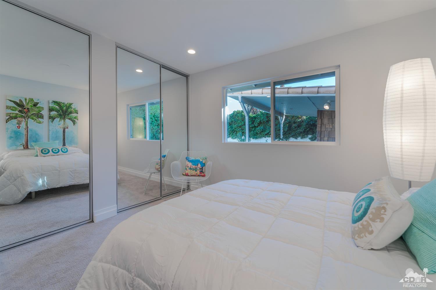 72845 Haystack Road Palm Desert, CA 92260 - Photo 28 of 39 a bedroom with a bed and a large window