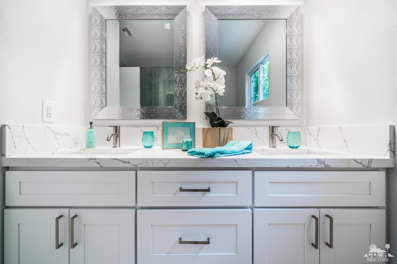 72845 Haystack Road Palm Desert, CA 92260 - Photo 29 of 39 a bathroom with a sink and a mirror