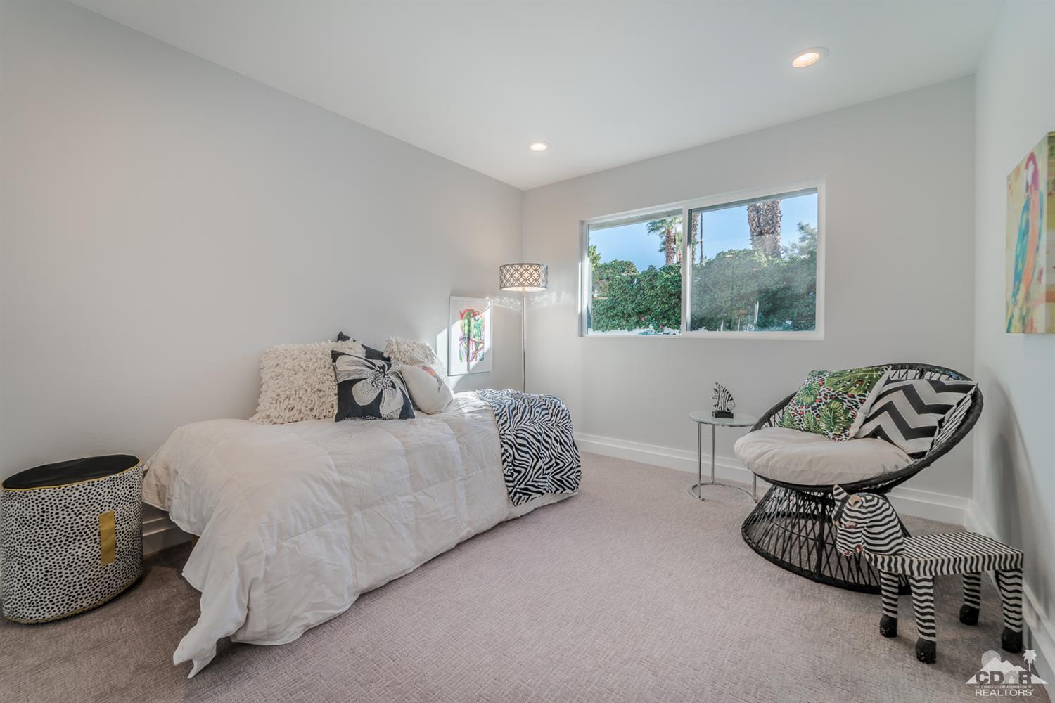 72845 Haystack Road Palm Desert, CA 92260 - Photo 31 of 39 a bedroom with a bed and a window