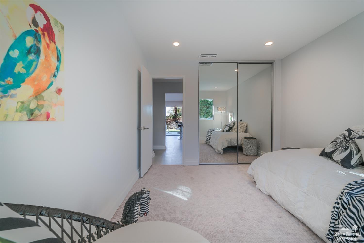 72845 Haystack Road Palm Desert, CA 92260 - Photo 32 of 39 a bedroom with furniture and a couch