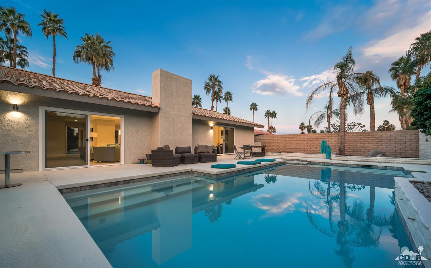 72845 Haystack Road Palm Desert, CA 92260 - Photo 36 of 39 a view of a house with swimming pool and sitting area
