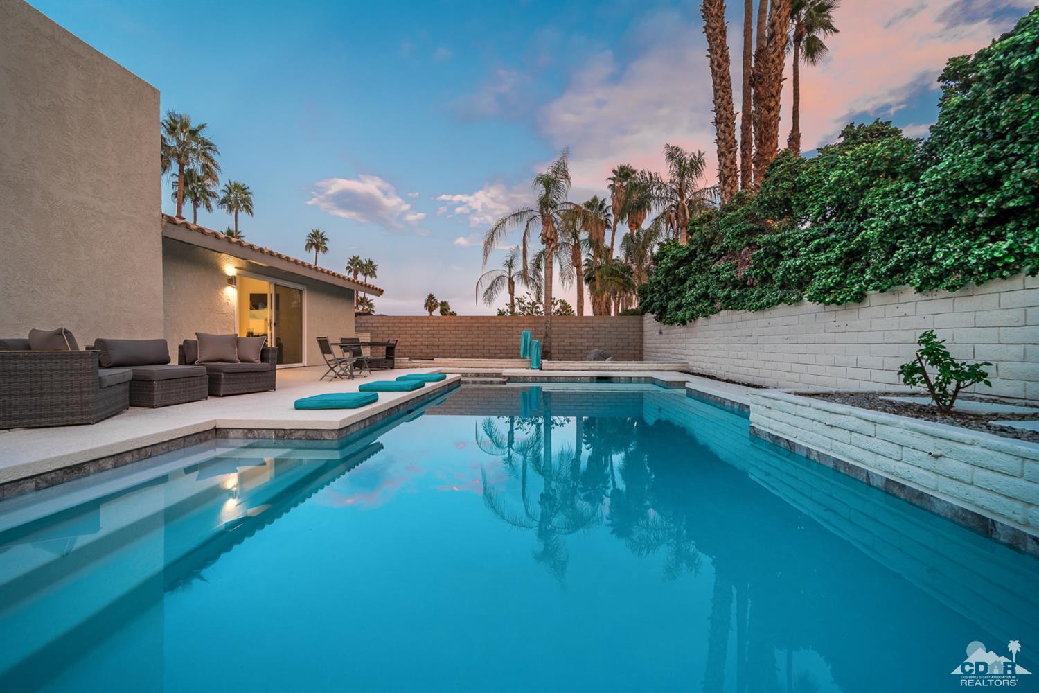72845 Haystack Road Palm Desert, CA 92260 - Photo 37 of 39 a view of swimming pool with outdoor seating and plants