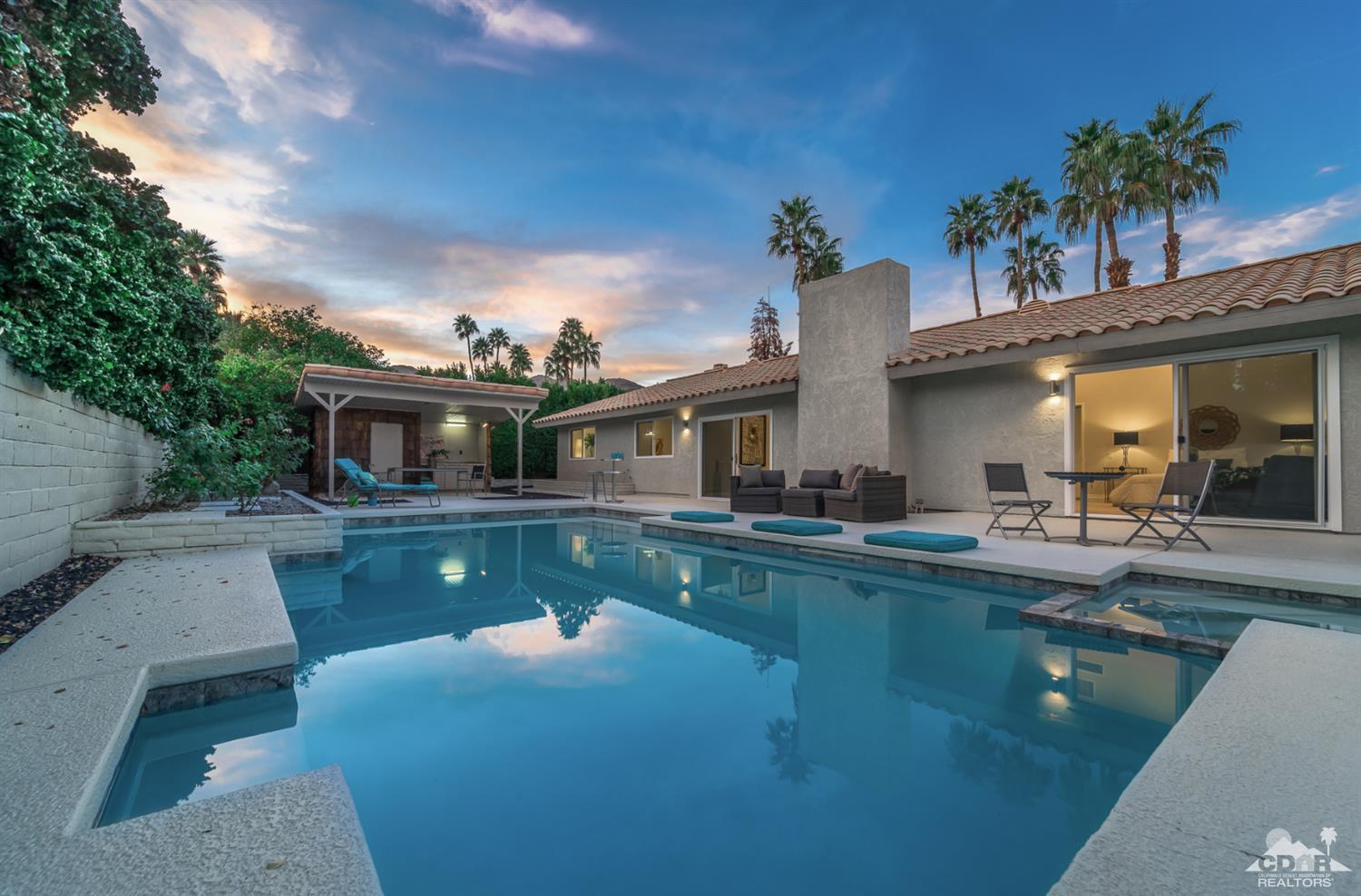 72845 Haystack Road Palm Desert, CA 92260 - Photo 38 of 39 a view of house with swimming pool outdoor seating