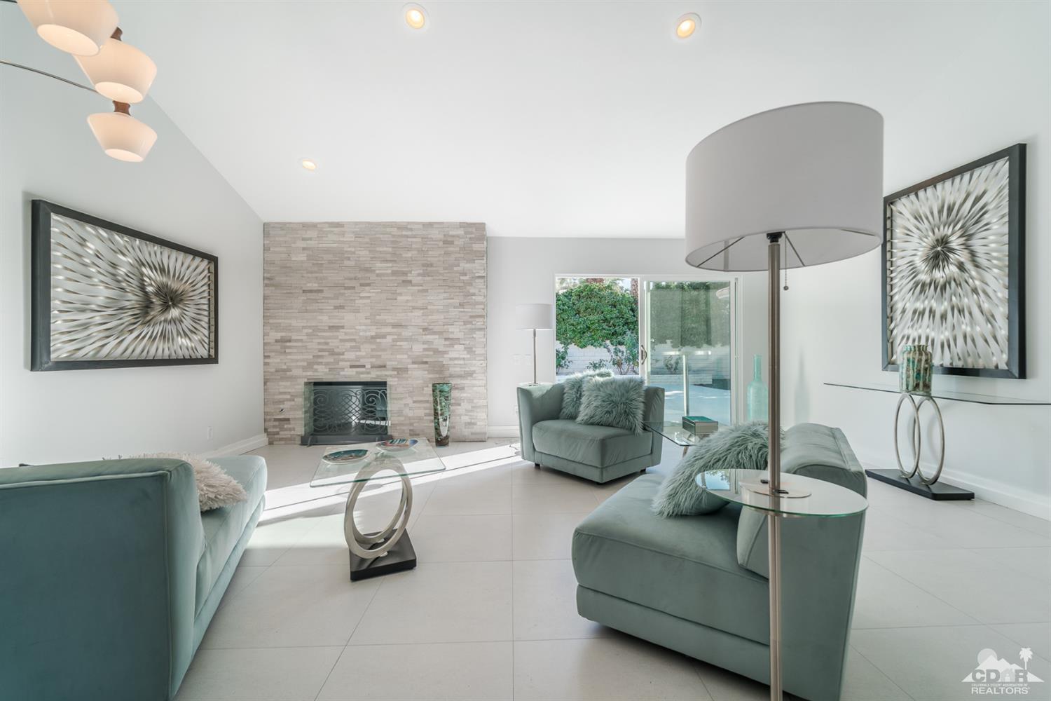 72845 Haystack Road Palm Desert, CA 92260 - Photo 6 of 39 a living room with furniture and a fireplace