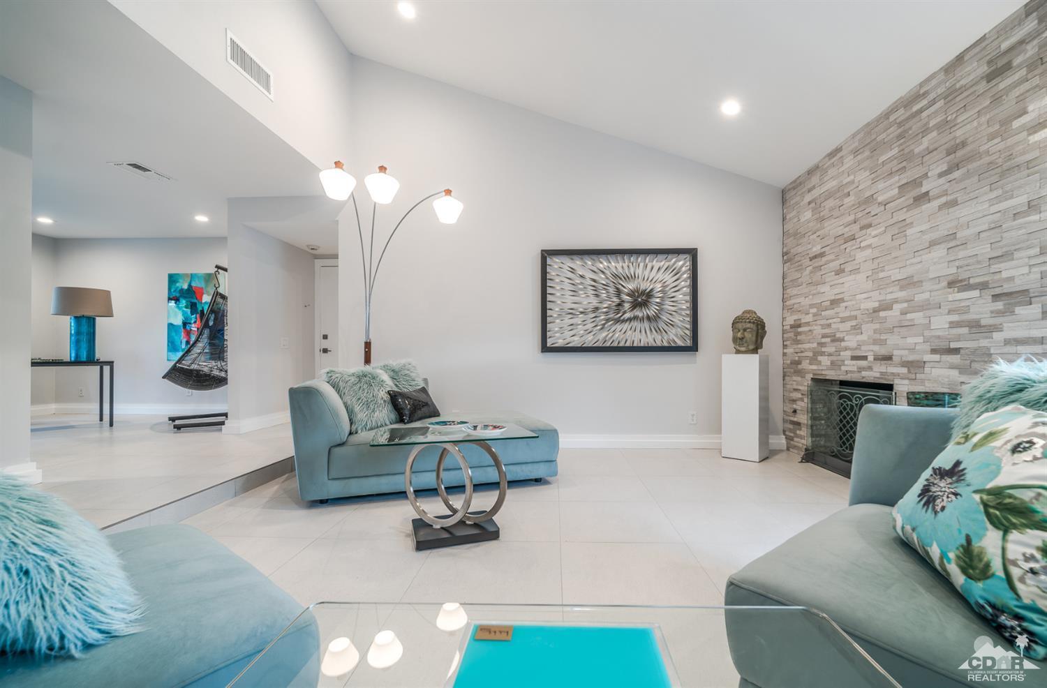 72845 Haystack Road Palm Desert, CA 92260 - Photo 8 of 39 a living room with furniture and a fireplace