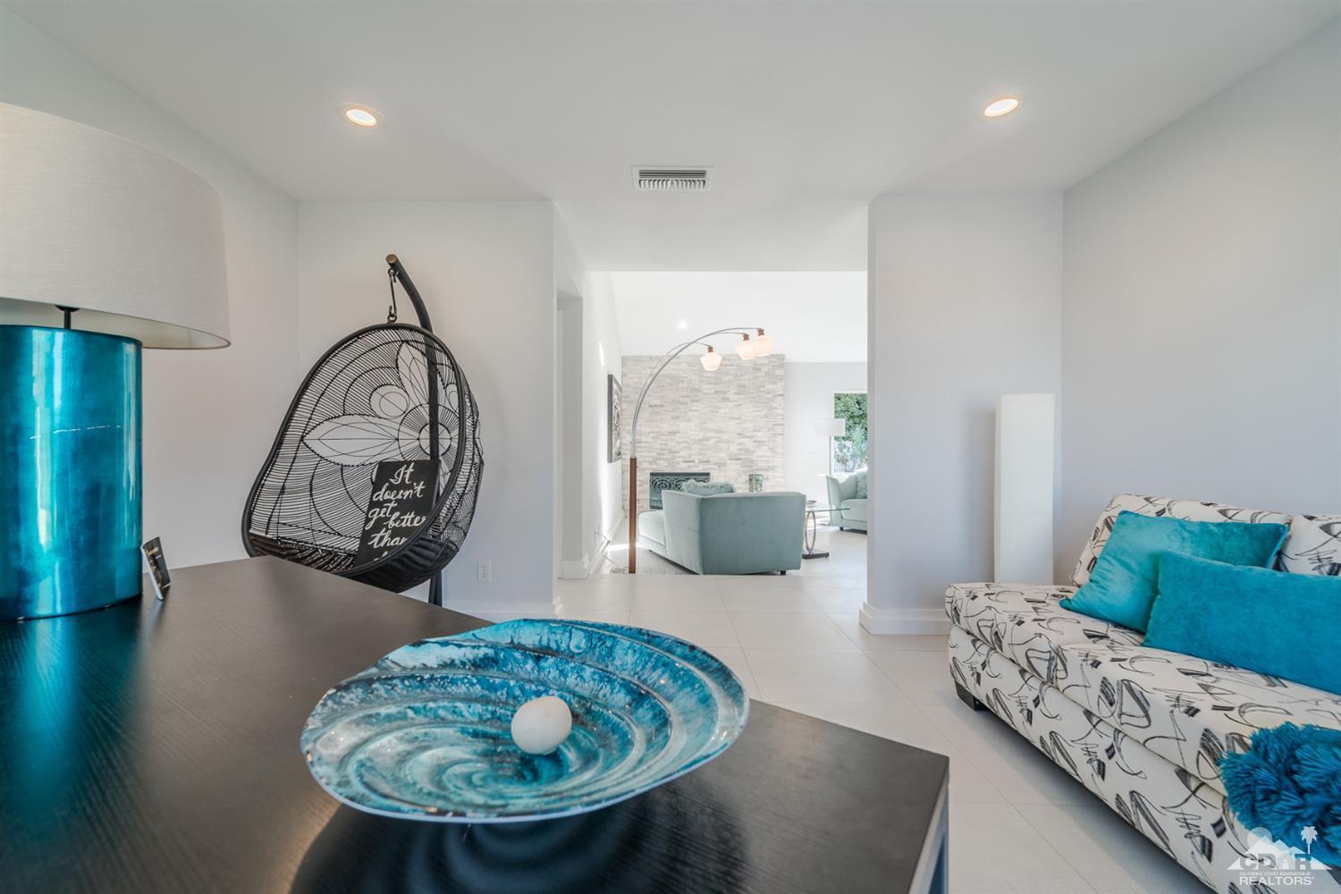 72845 Haystack Road Palm Desert, CA 92260 - Photo 9 of 39 a living room with furniture and a mirror