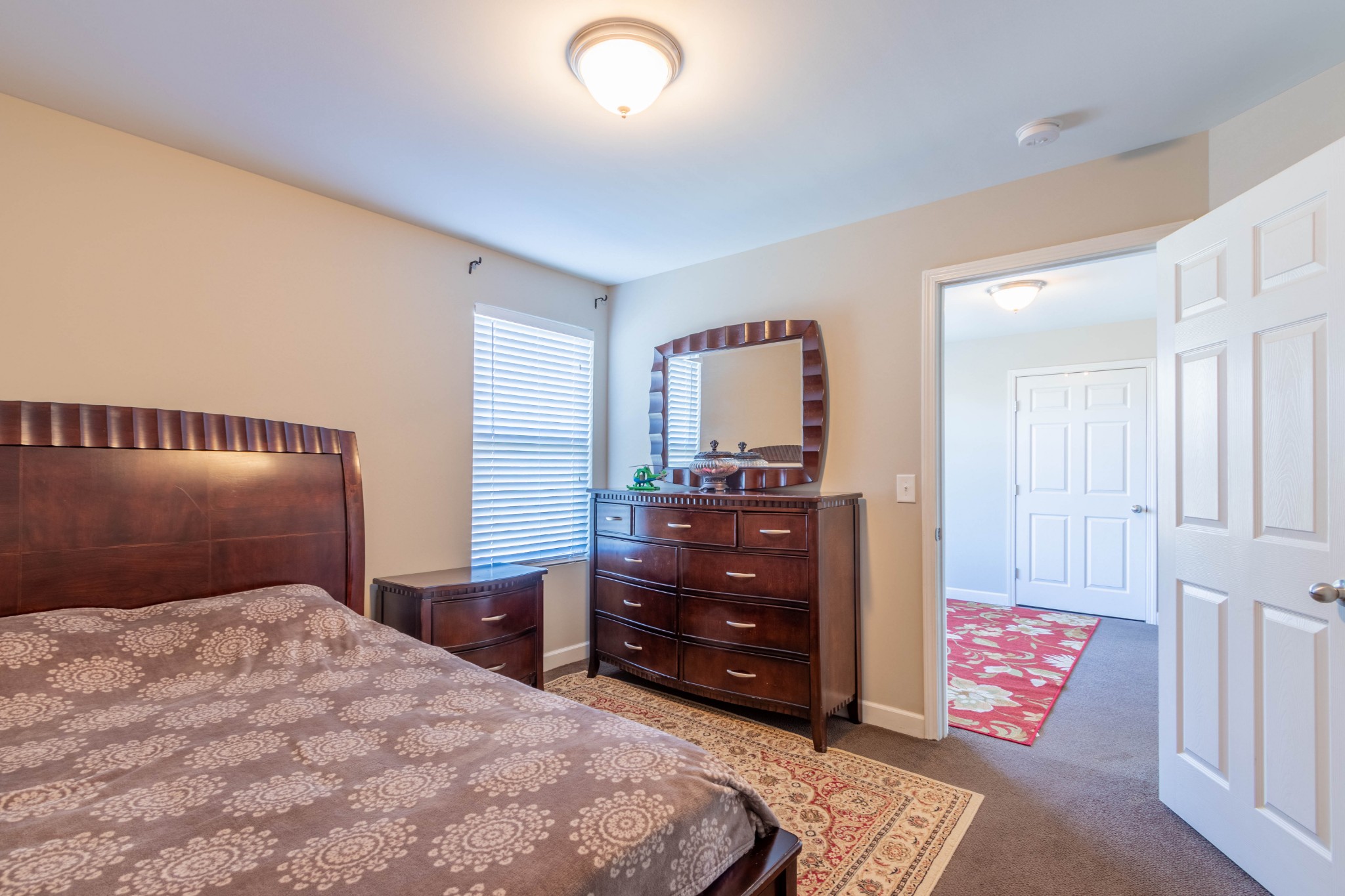 6017 Cane Springs Road Antioch, TN 37013 - Photo 16 of 35 a bedroom with a bed and a dresser