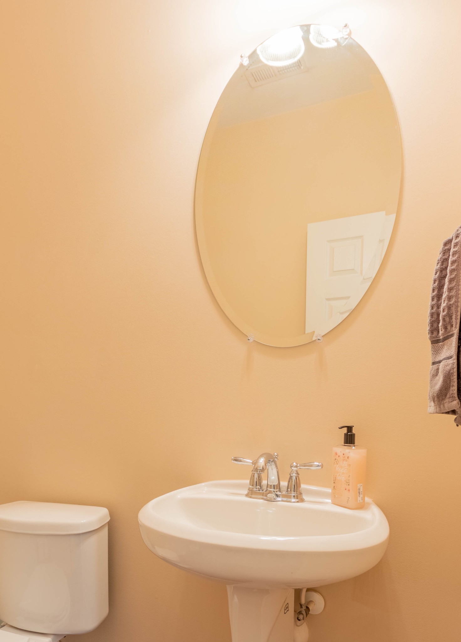 6017 Cane Springs Road Antioch, TN 37013 - Photo 19 of 35 a bathroom with a sink a toilet and a mirror