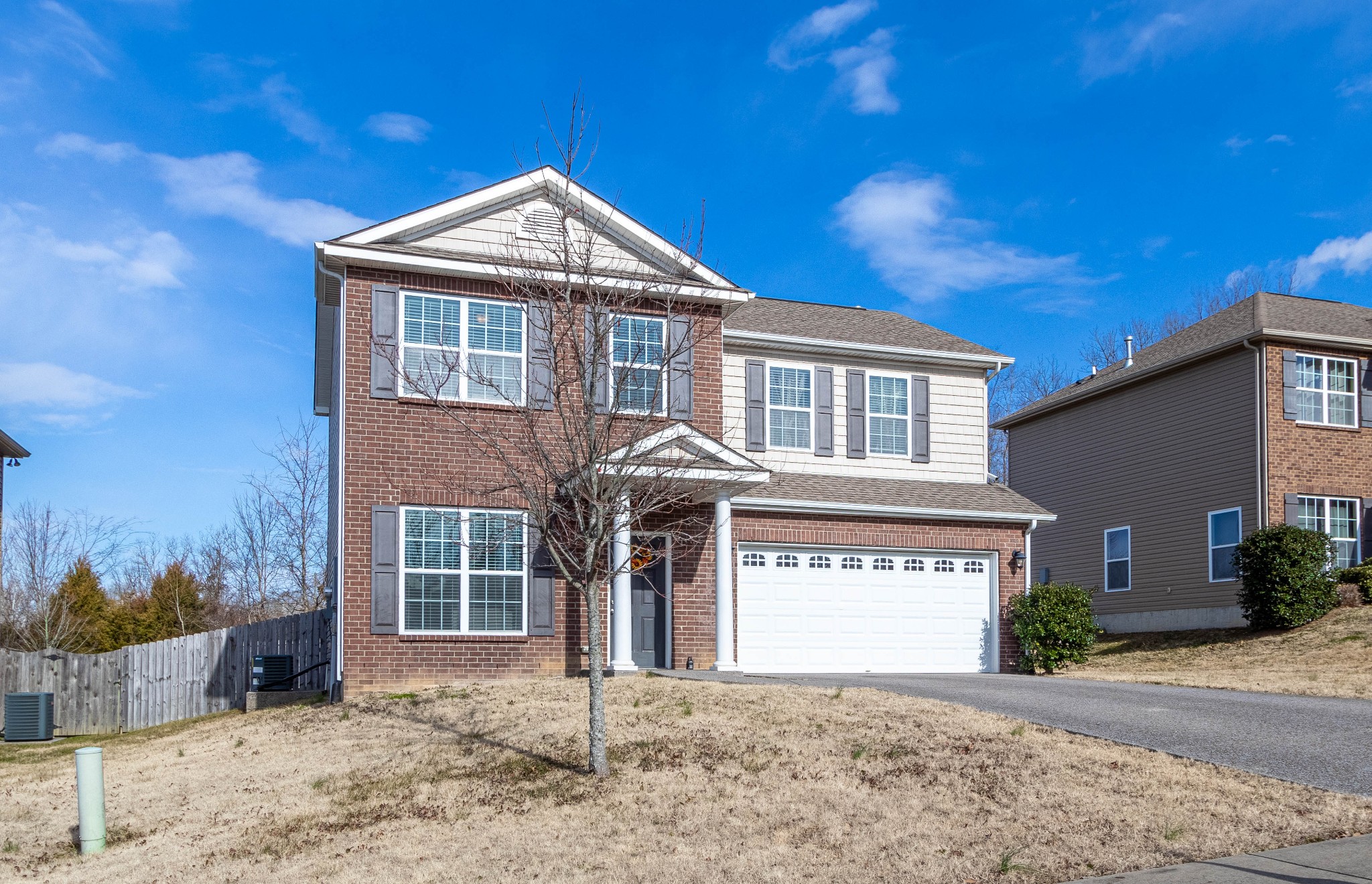 6017 Cane Springs Road Antioch, TN 37013 - Photo 3 of 35 a front view of a house with a yard and garage
