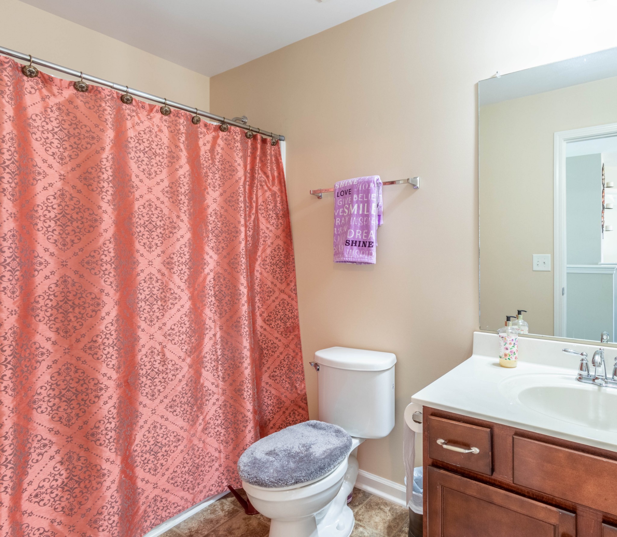 6017 Cane Springs Road Antioch, TN 37013 - Photo 21 of 35 a bathroom with a sink a toilet and a mirror