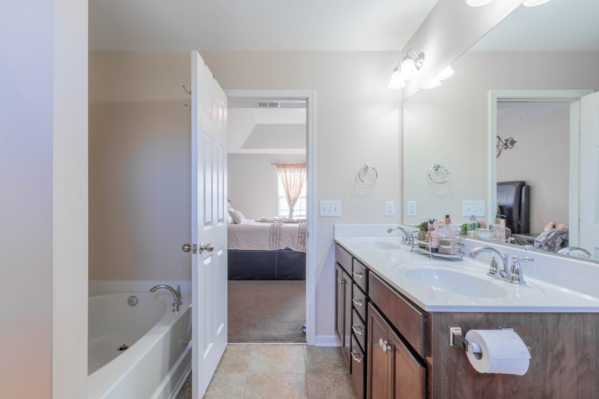 6017 Cane Springs Road Antioch, TN 37013 - Photo 27 of 35 a bathroom with a sink a tub and a mirror
