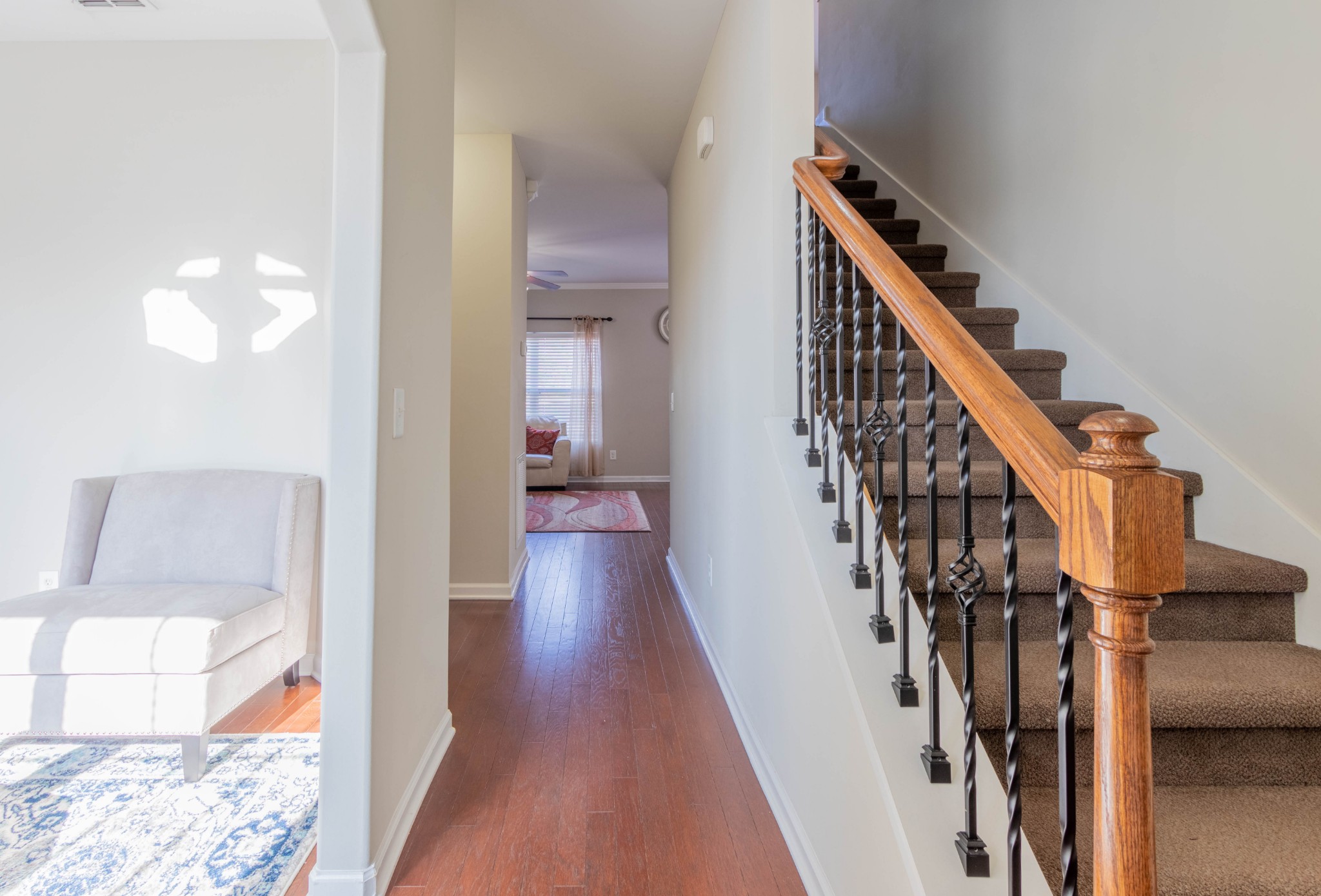 6017 Cane Springs Road Antioch, TN 37013 - Photo 6 of 35 a view of a hallway with wooden floor and staircase