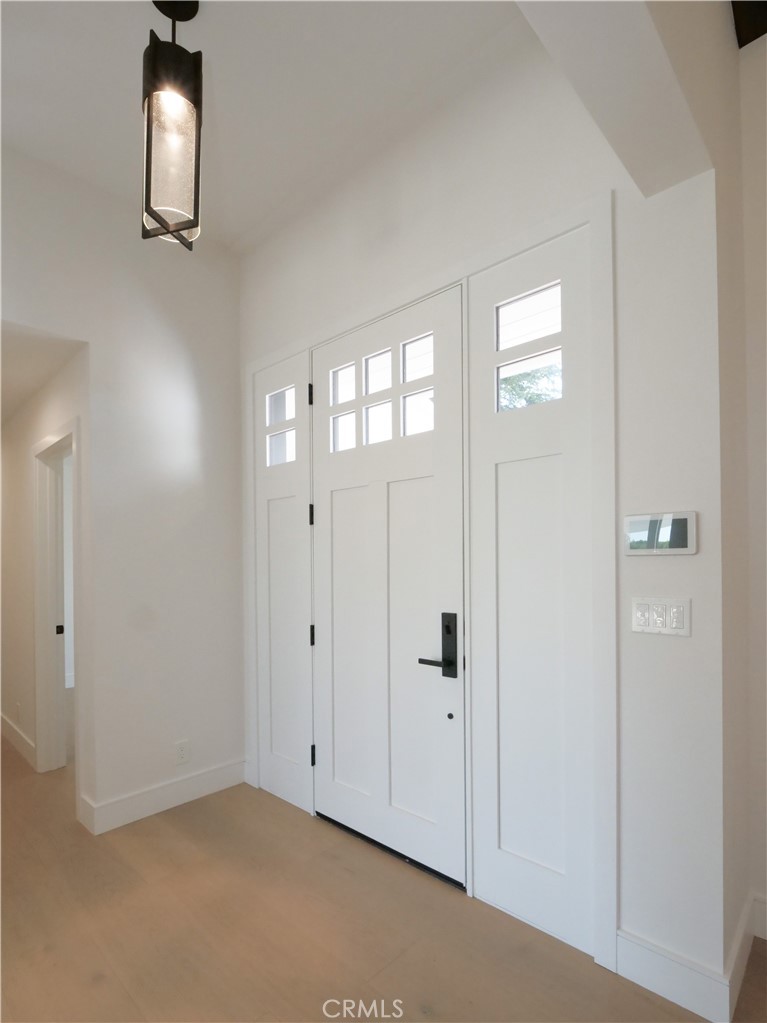 2 Flying Mane Road Rolling Hills, CA 90274 - Photo 14 of 49 an empty room with wooden floor and windows