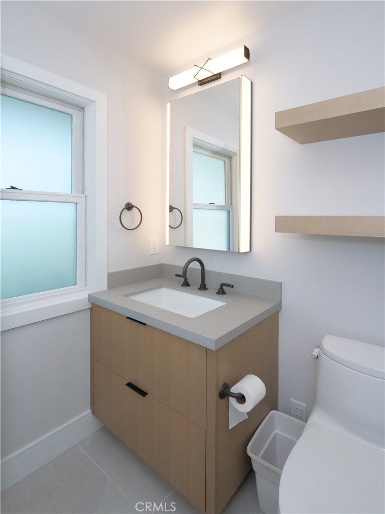 2 Flying Mane Road Rolling Hills, CA 90274 - Photo 21 of 49 a bathroom with a toilet a sink and mirror