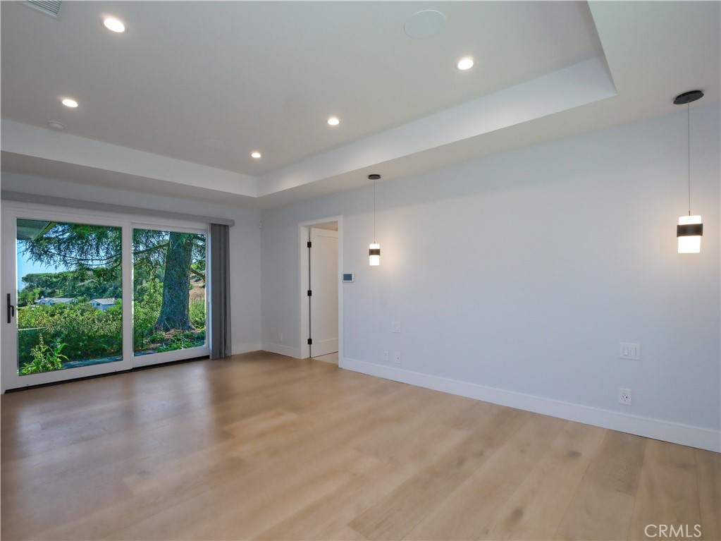 2 Flying Mane Road Rolling Hills, CA 90274 - Photo 29 of 49 a view of an empty room with wooden floor and a window