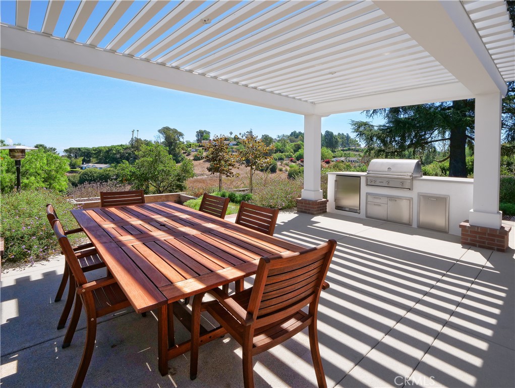 2 Flying Mane Road Rolling Hills, CA 90274 - Photo 42 of 49 a patio with glass top table and chairs