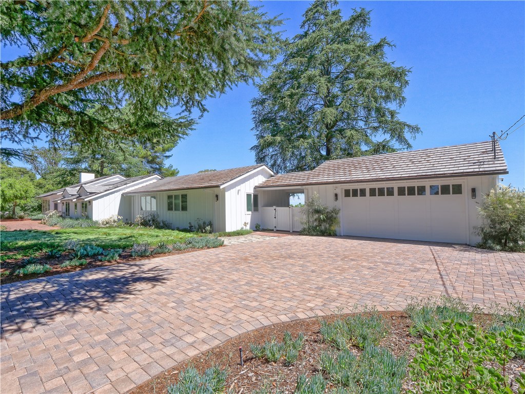 2 Flying Mane Road Rolling Hills, CA 90274 - Photo 48 of 49 a front view of a house with a yard and a garage
