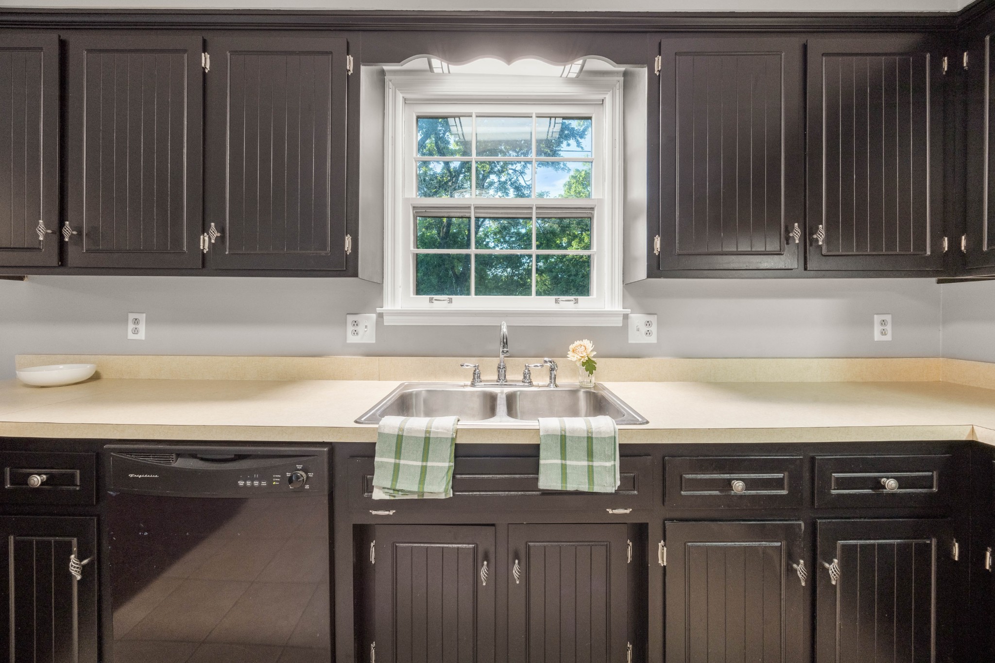 407 Idaho Springs Road Clarksville, TN 37043 - Photo 14 of 45 a kitchen with a sink a window and cabinets