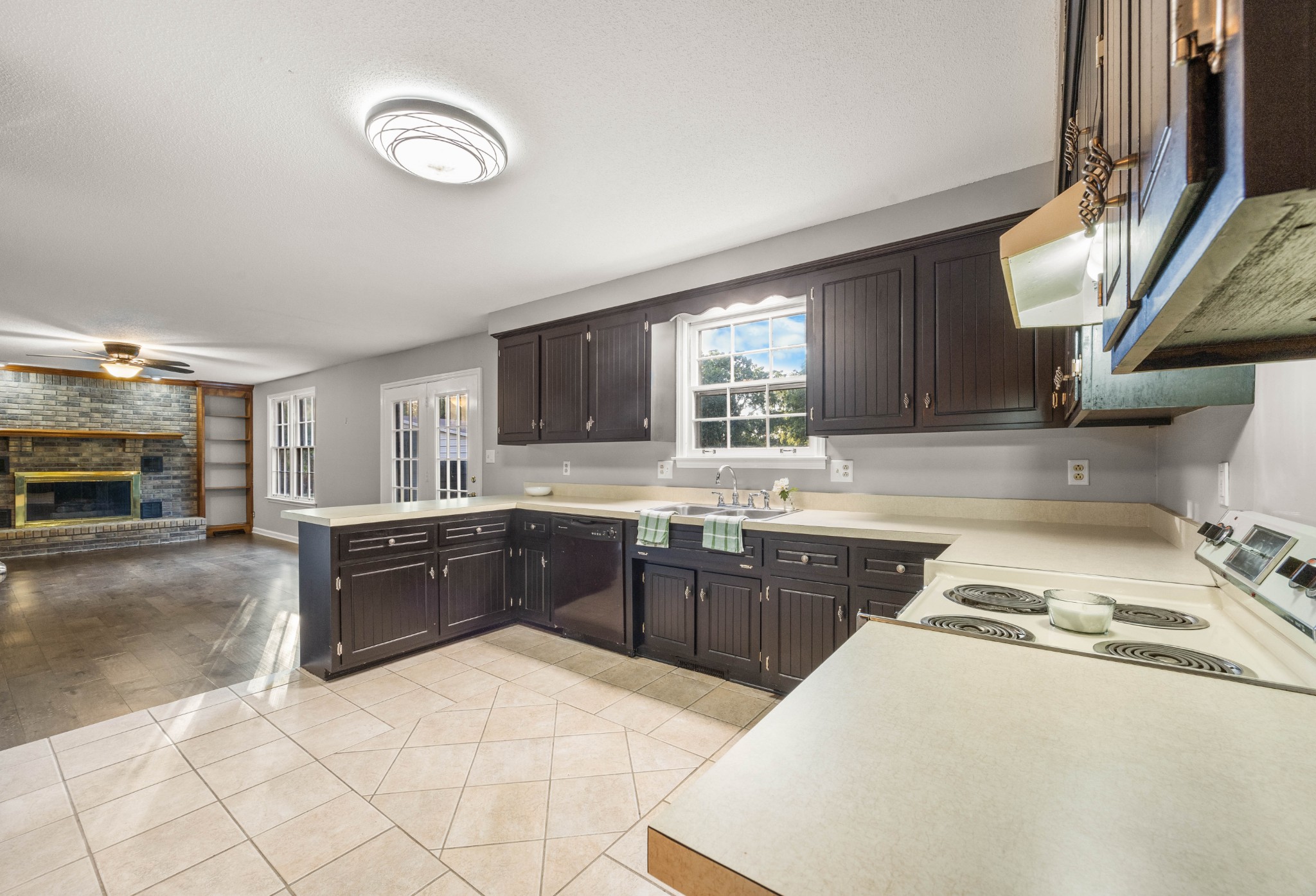 407 Idaho Springs Road Clarksville, TN 37043 - Photo 15 of 45 a kitchen with a sink a stove and cabinets