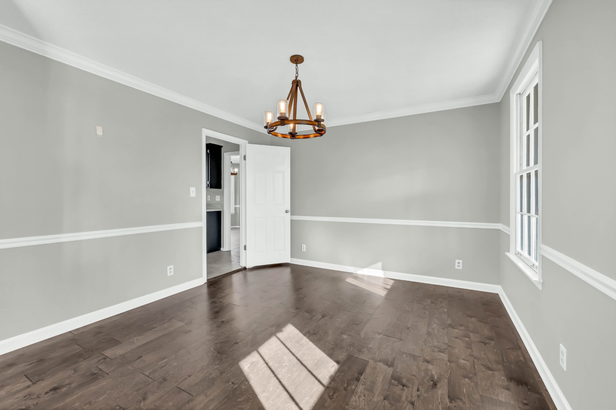 407 Idaho Springs Road Clarksville, TN 37043 - Photo 16 of 45 wooden floor in an empty room with a window