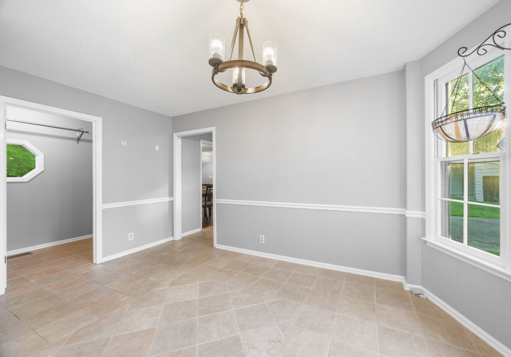407 Idaho Springs Road Clarksville, TN 37043 - Photo 20 of 45 an empty room with windows and chandelier