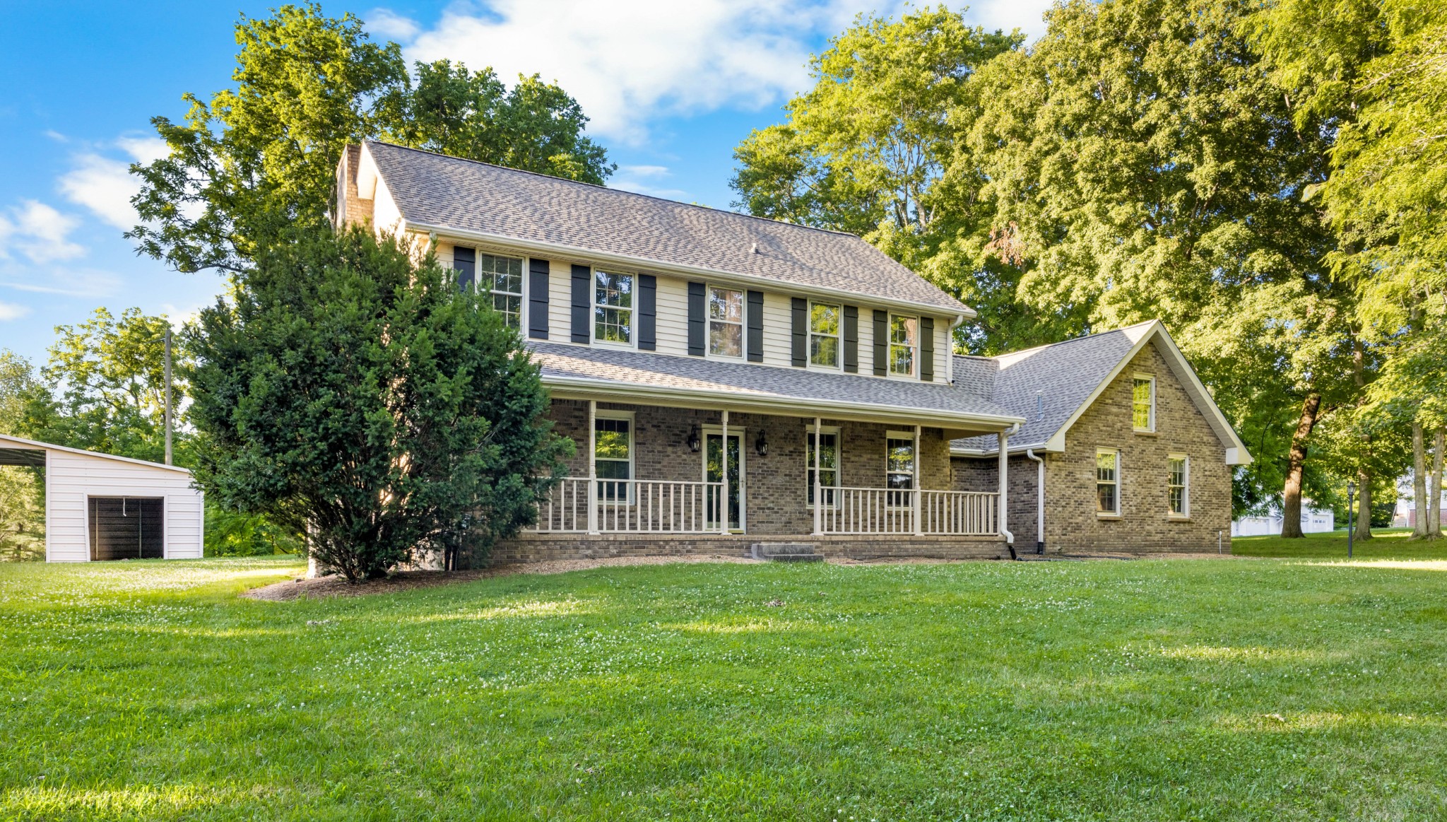 407 Idaho Springs Road Clarksville, TN 37043 - Photo 2 of 45 a front view of a house with a garden