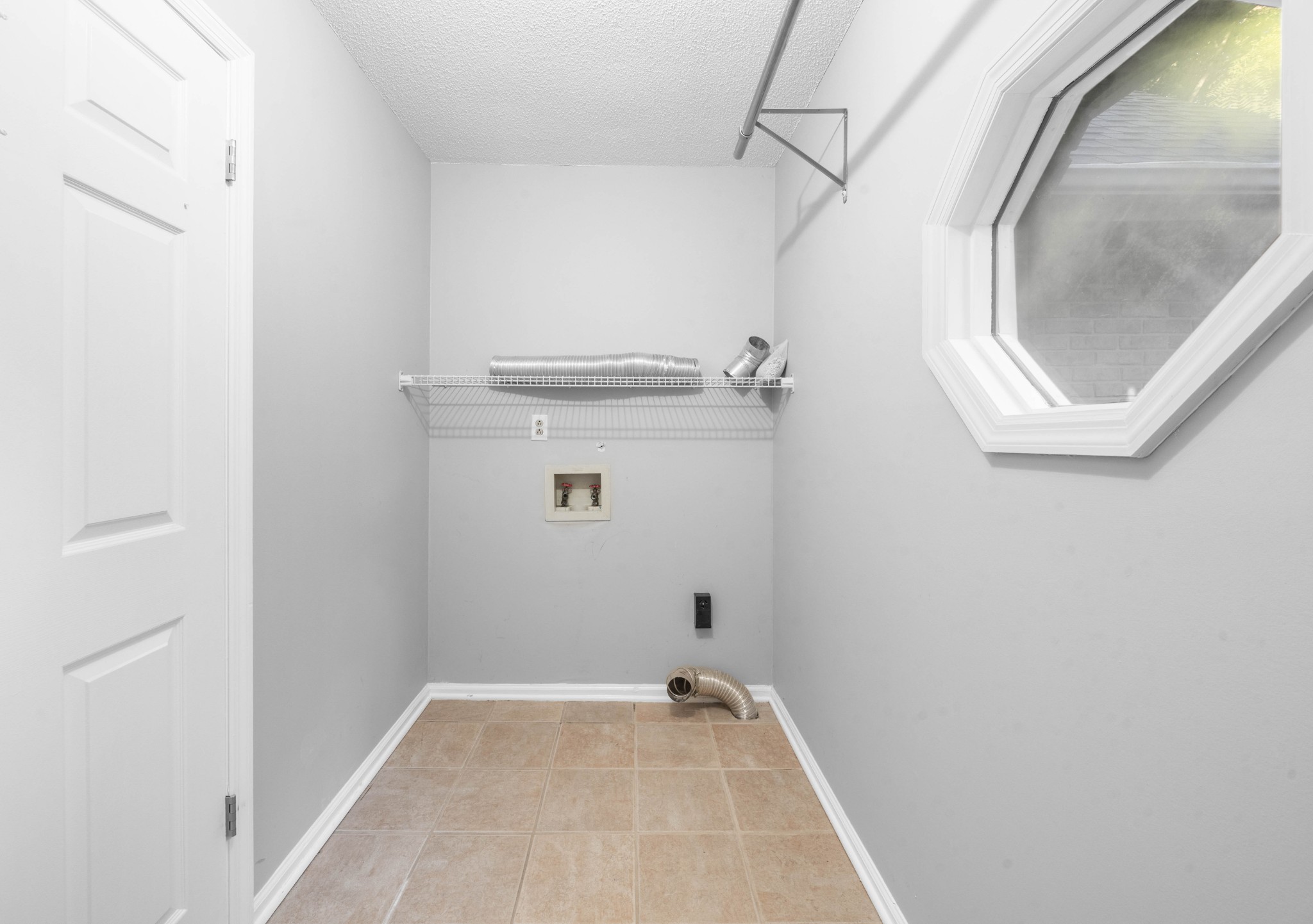 407 Idaho Springs Road Clarksville, TN 37043 - Photo 21 of 45 a view of a room with rack on the wall