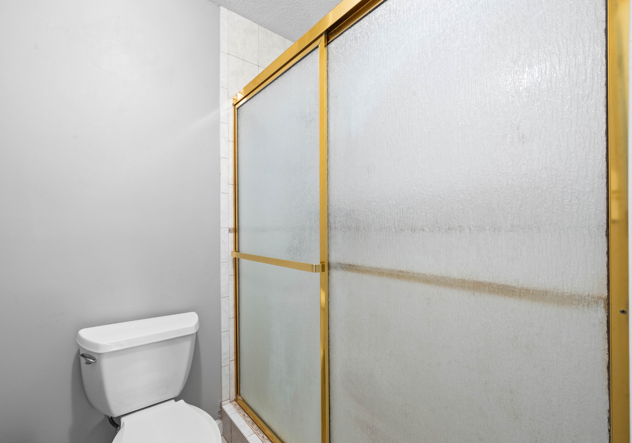 407 Idaho Springs Road Clarksville, TN 37043 - Photo 26 of 45 a bathroom with a toilet and a shower