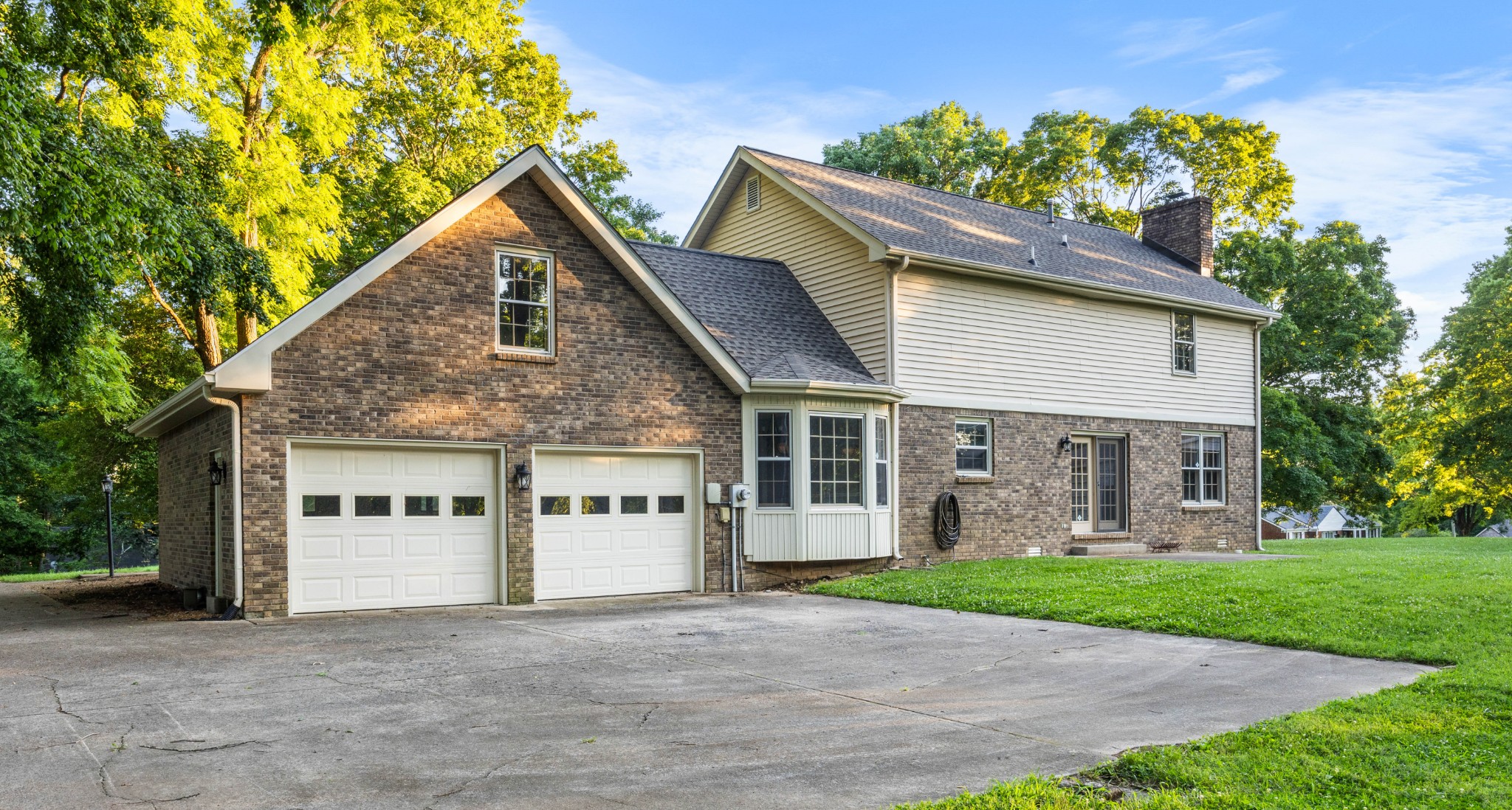 407 Idaho Springs Road Clarksville, TN 37043 - Photo 35 of 45 a front view of a house with a garden and plants