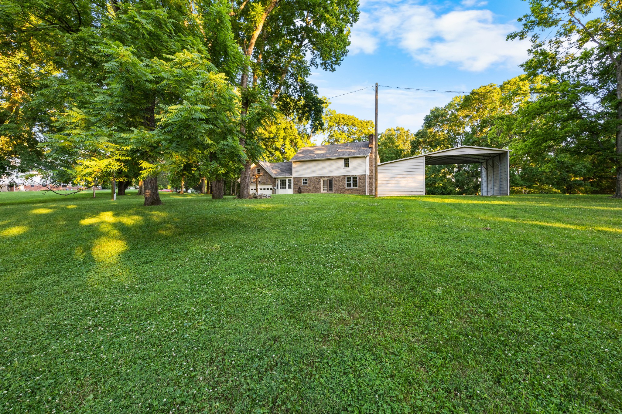 407 Idaho Springs Road Clarksville, TN 37043 - Photo 36 of 45 a view of a big yard next to a house