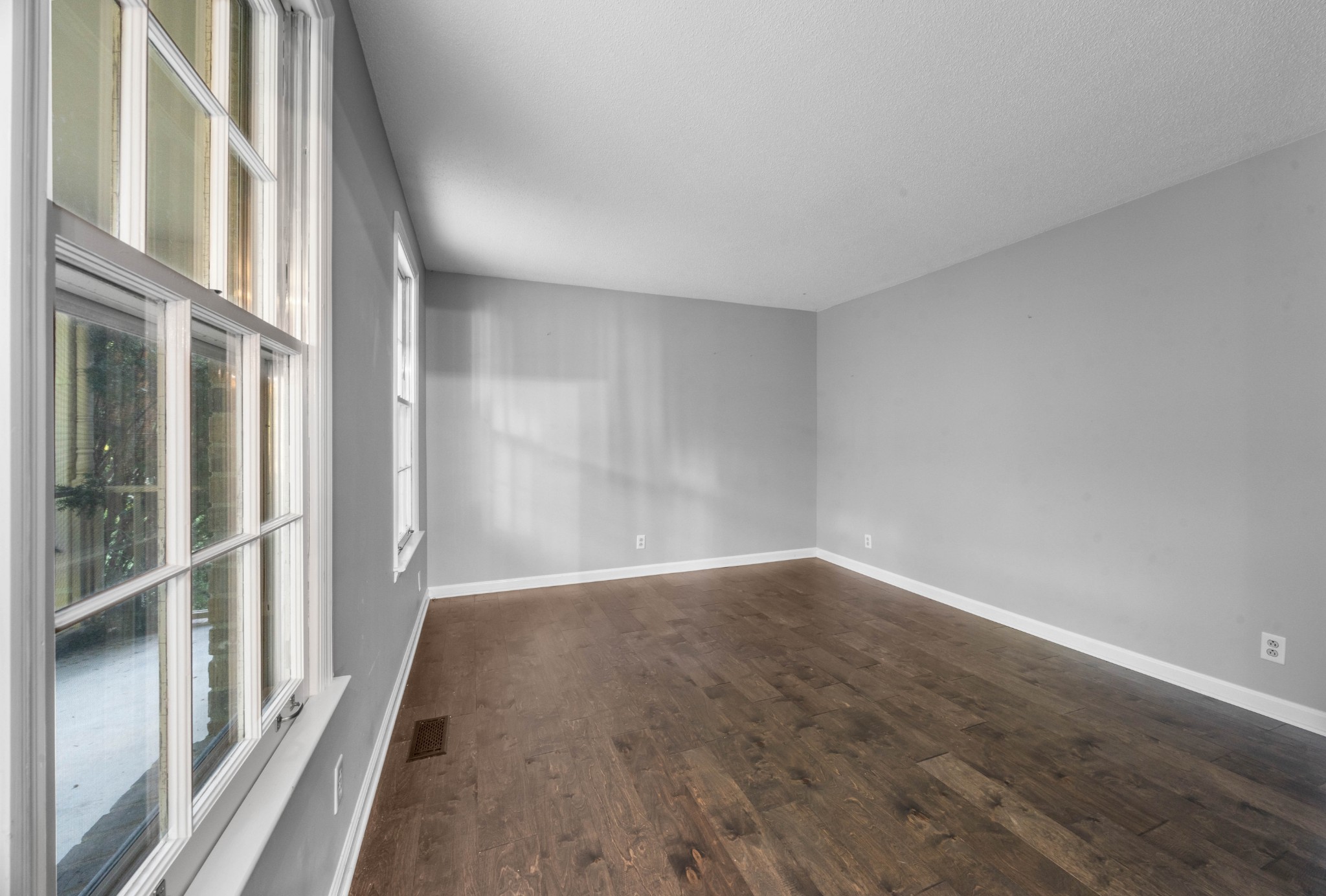 407 Idaho Springs Road Clarksville, TN 37043 - Photo 6 of 45 a view of an empty room with wooden floor and a window