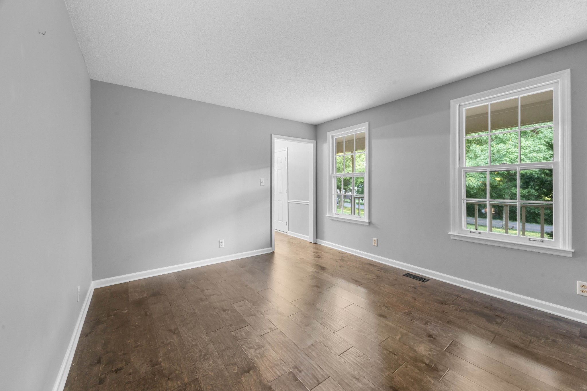407 Idaho Springs Road Clarksville, TN 37043 - Photo 7 of 45 a view of an empty room with wooden floor and a window
