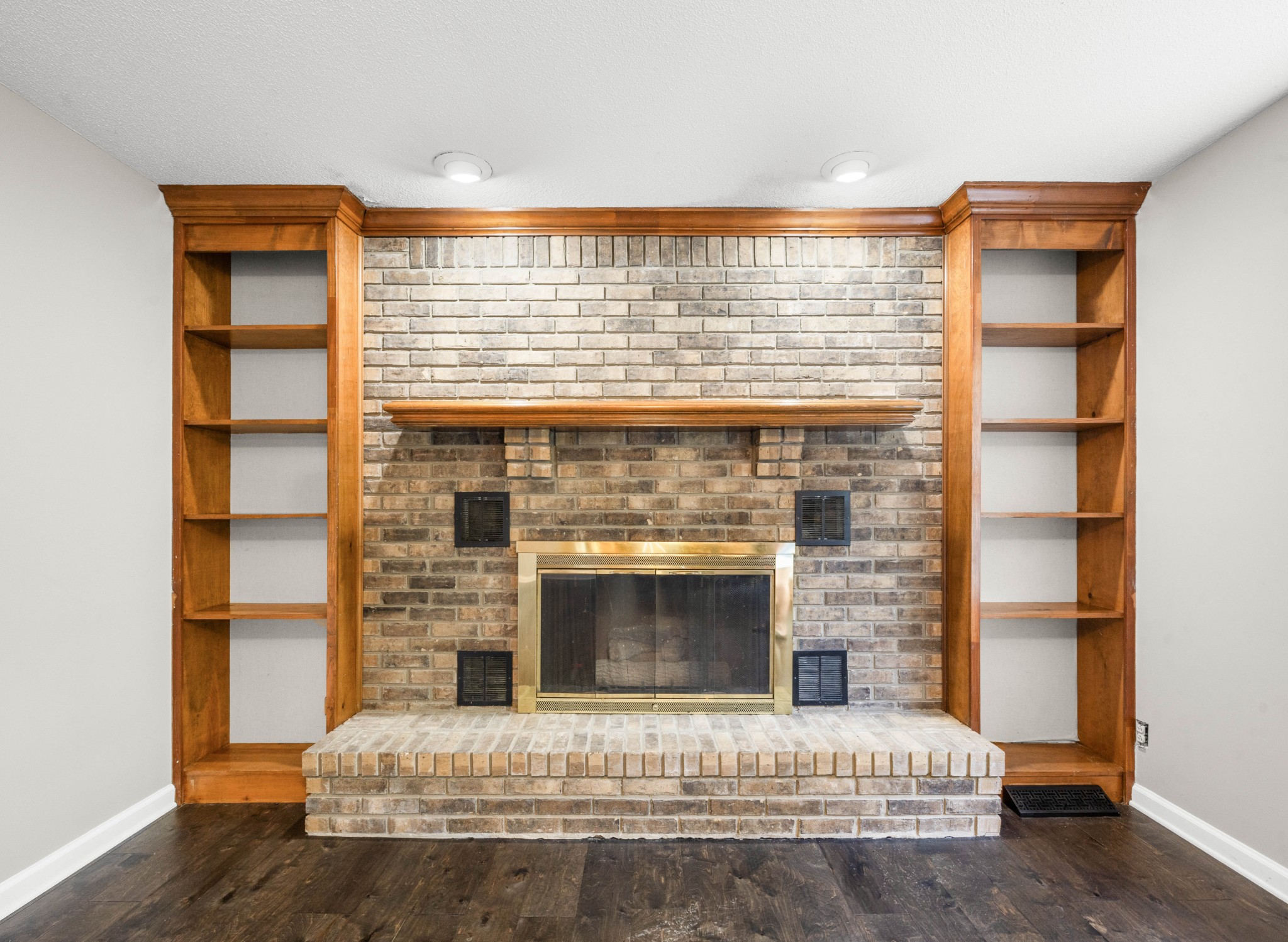 407 Idaho Springs Road Clarksville, TN 37043 - Photo 10 of 45 a living room with a fireplace and a floor