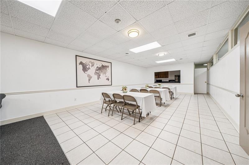 5 Bayard Road, Unit 309 Pittsburgh, PA 15213 - Photo 19 of 22 a living room with furniture and view of kitchen