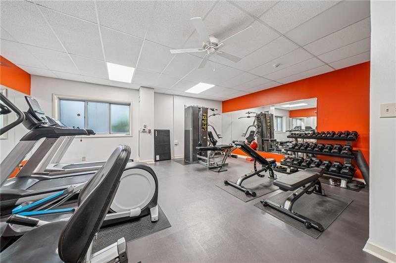 5 Bayard Road, Unit 309 Pittsburgh, PA 15213 - Photo 20 of 22 a room with gym equipment and large mirror