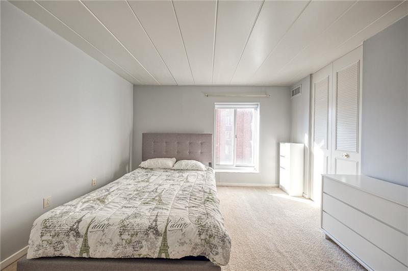 5 Bayard Road, Unit 309 Pittsburgh, PA 15213 - Photo 6 of 22 a bedroom with a bed and a window