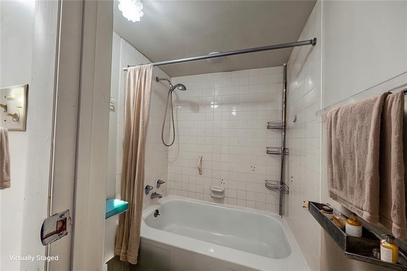 5 Bayard Road, Unit 309 Pittsburgh, PA 15213 - Photo 8 of 22 a bathroom with a shower and a bathtub