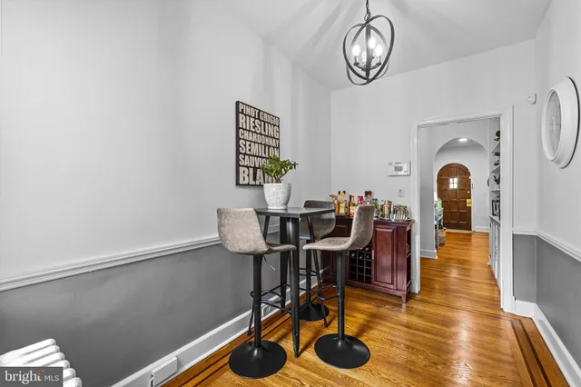 a view of a dining room with furniture wooden floor and a rug