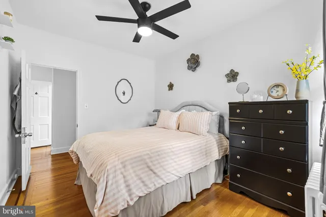 a bedroom with a bed and a dresser